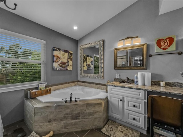 7409 Harbor Dr, Rowlett, TX 75088 - bathroom featuring vanity, a bath, tile patterned floors, and lofted ceiling
