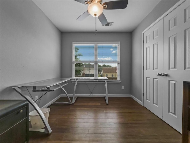 7409 Harbor Dr, Rowlett, TX 75088 - unfurnished office featuring ceiling fan, dark wood-style flooring, and baseboards