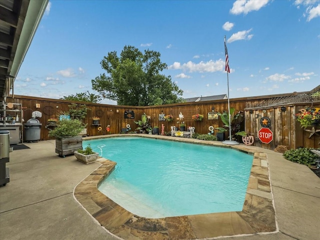 7409 Harbor Dr, Rowlett, TX 75088 - view of pool with a fenced backyard, a grill, and a patio area