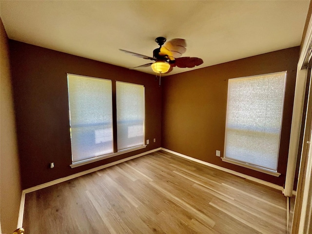 2955 Allister St, Dallas, TX 75229 - unfurnished room featuring baseboards, plenty of natural light, wood finished floors, and a ceiling fan