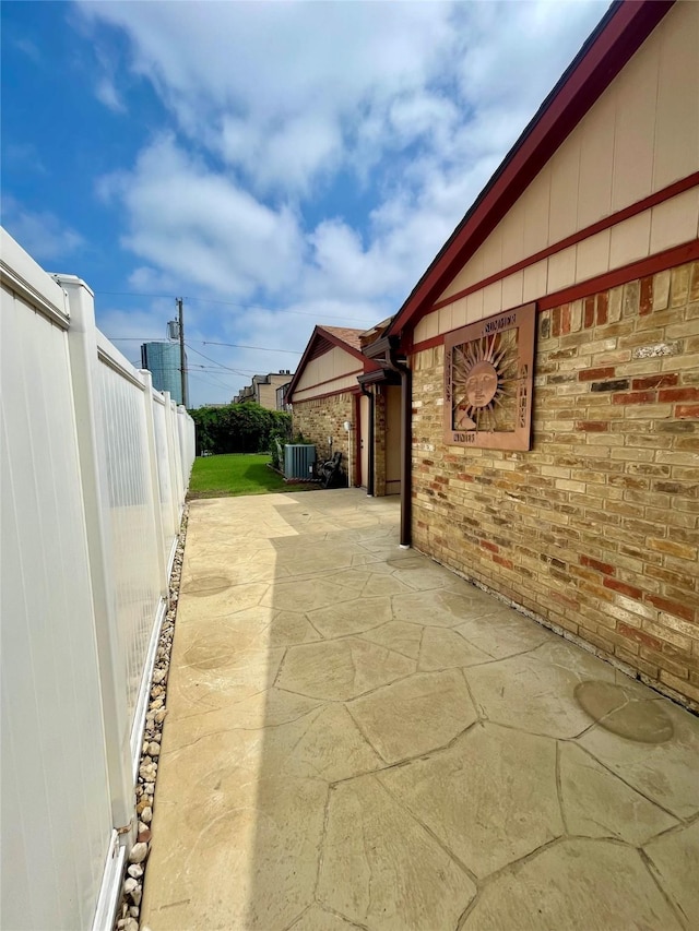 2955 Allister St, Dallas, TX 75229 - view of patio / terrace featuring central AC