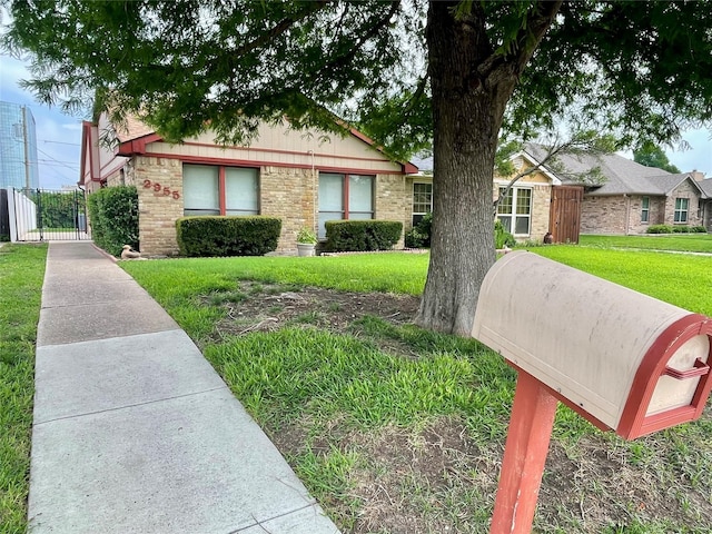 2955 Allister St, Dallas, TX 75229 - view of front of house featuring a gate and brick siding