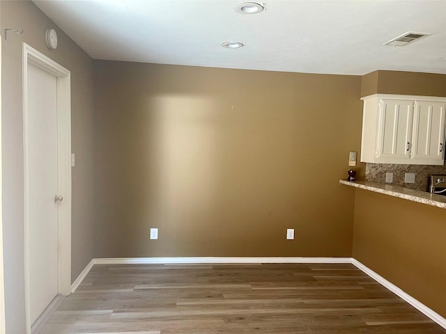 2955 Allister St, Dallas, TX 75229 - unfurnished dining area featuring light wood-style flooring, baseboards, and recessed lighting