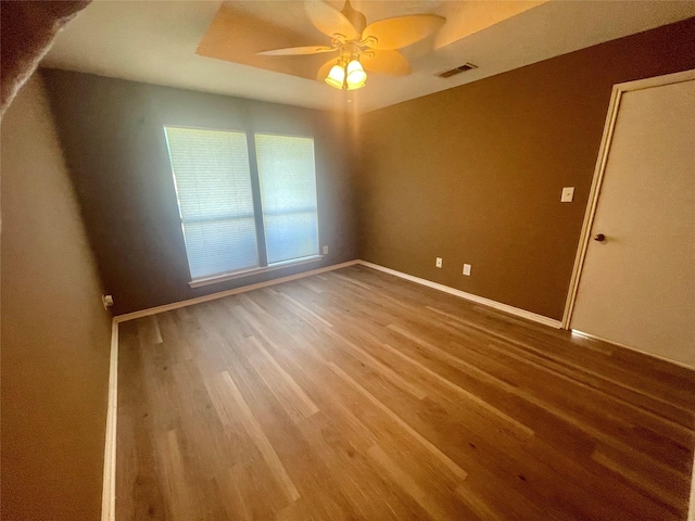 2955 Allister St, Dallas, TX 75229 - spare room with wood finished floors, a ceiling fan, and baseboards