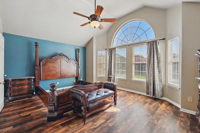 7100 Fox Dr, The Colony, TX 75056 - bedroom with lofted ceiling, wood finished floors, a textured ceiling, baseboards, and a ceiling fan