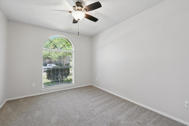 7100 Fox Dr, The Colony, TX 75056 - carpeted spare room featuring a textured ceiling, ceiling fan, and baseboards