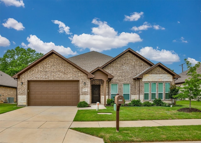 1129 Vintage Ave, Gainesville, TX 76240 - french country home featuring brick siding, a garage, a front yard, and central air condition unit