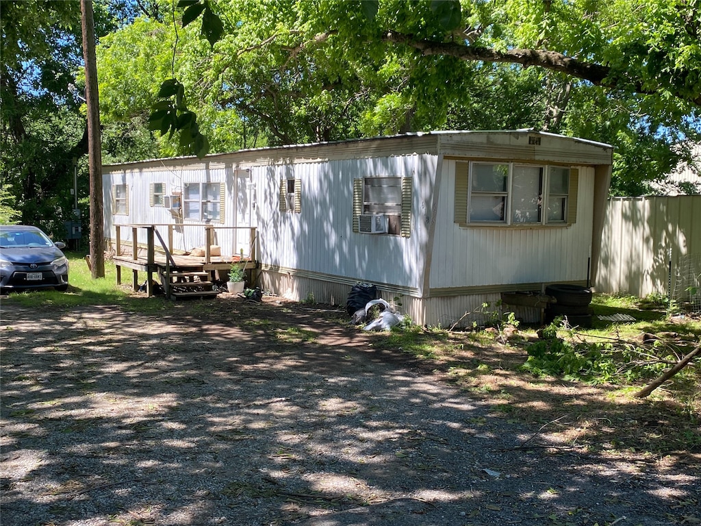 616 Rice St, Denison, TX 75020 - manufactured / mobile home with a deck and cooling unit