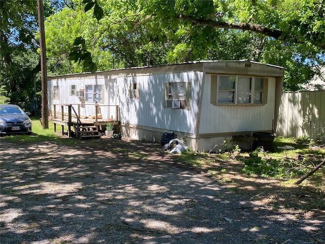 616 Rice St, Denison, TX 75020 - manufactured / mobile home with a deck and cooling unit