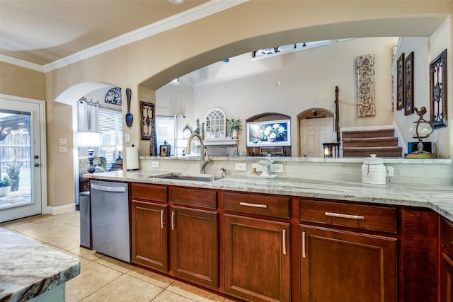 2801 Adams Dr, Melissa, TX 75454 - kitchen featuring stainless steel dishwasher, a sink, light stone countertops, arched walkways, and light tile patterned floors