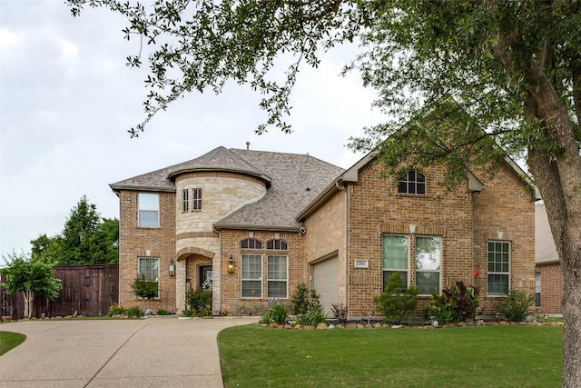 2801 Adams Dr, Melissa, TX 75454 - french country inspired facade featuring an attached garage, brick siding, concrete driveway, and roof with shingles