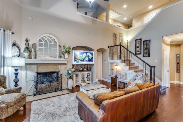 2801 Adams Dr, Melissa, TX 75454 - living room with a high ceiling, stairway, wood finished floors, a fireplace, and a ceiling fan