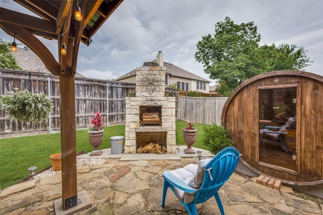 2801 Adams Dr, Melissa, TX 75454 - view of patio / terrace with an outdoor stone fireplace