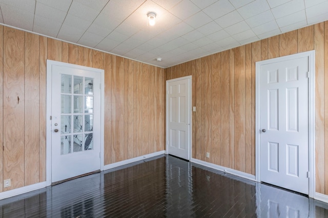901 E Walnut St, Hillsboro, TX 76645 - spare room with wood walls and baseboards