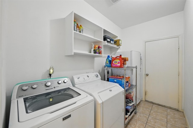 9829 Crawford Farms Dr, Fort Worth, TX 76244 - washroom with independent washer and dryer and light tile patterned floors