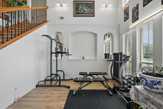 9829 Crawford Farms Dr, Fort Worth, TX 76244 - workout area with wood finished floors, a high ceiling, and baseboards