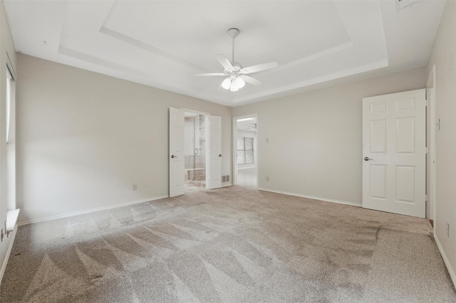 5518 Oak Branch Dr, Arlington, TX 76016 - unfurnished bedroom featuring a tray ceiling, carpet, and baseboards