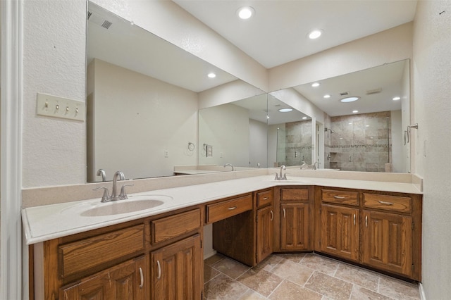 5518 Oak Branch Dr, Arlington, TX 76016 - bathroom with double vanity, a shower stall, recessed lighting, and stone finish floors