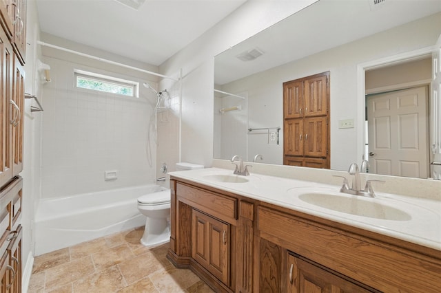 5518 Oak Branch Dr, Arlington, TX 76016 - full bathroom featuring bathing tub / shower combination, double vanity, toilet, and stone finish flooring