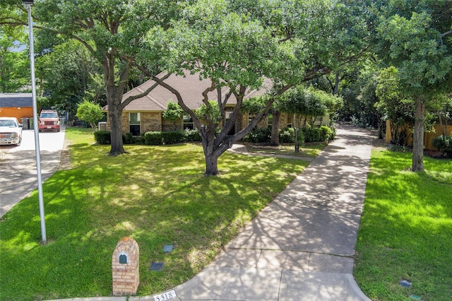 5518 Oak Branch Dr, Arlington, TX 76016 - obstructed view of property featuring a front yard and brick siding