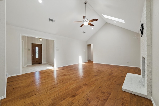 5518 Oak Branch Dr, Arlington, TX 76016 - unfurnished living room with ceiling fan, high vaulted ceiling, a brick fireplace, wood finished floors, and recessed lighting