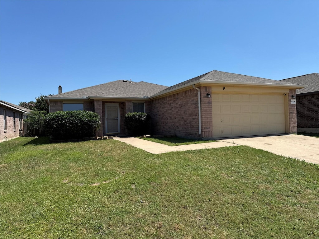 4004 Tiburon St, Fort Worth, TX 76106 - ranch-style home featuring brick siding, a garage, a front yard, and concrete driveway