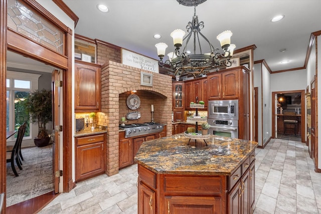 719 Morningside Dr, Mansfield, TX 76063 - kitchen with appliances with stainless steel finishes, a chandelier, decorative backsplash, ornamental molding, and dark stone countertops