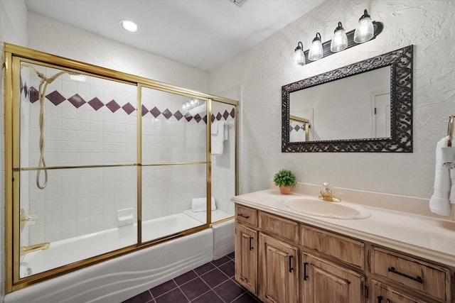 719 Morningside Dr, Mansfield, TX 76063 - full bath with tile patterned floors, a textured wall, vanity, and shower / bath combination with glass door