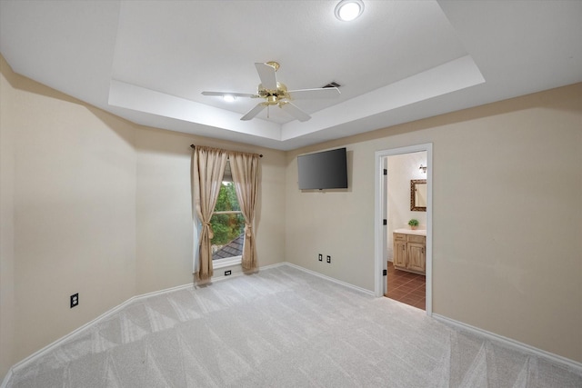 719 Morningside Dr, Mansfield, TX 76063 - empty room featuring light colored carpet, a tray ceiling, ceiling fan, and baseboards
