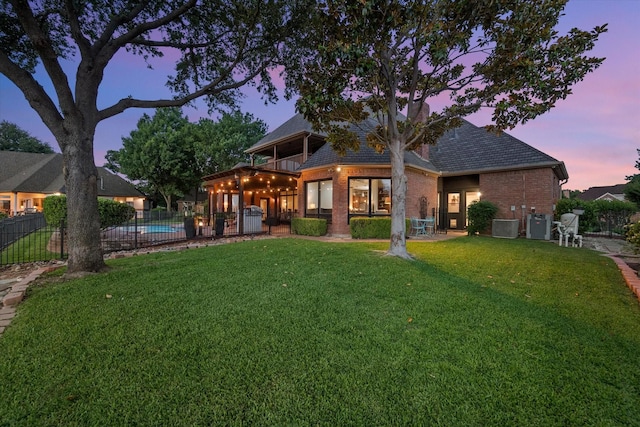 719 Morningside Dr, Mansfield, TX 76063 - back of house featuring brick siding and roof with shingles