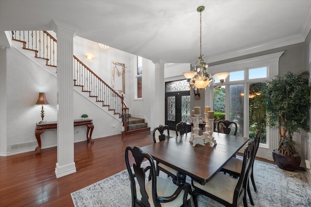 719 Morningside Dr, Mansfield, TX 76063 - dining room featuring stairs, decorative columns, wood finished floors, a chandelier, and crown molding