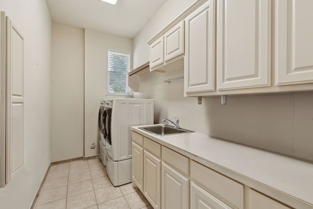 6 Trailside Ct, Mansfield, TX 76063 - laundry room featuring separate washer and dryer, cabinet space, light tile patterned flooring, and baseboards