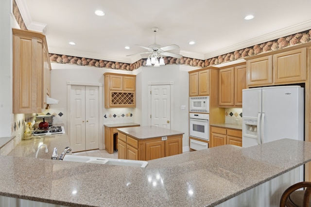 6 Trailside Ct, Mansfield, TX 76063 - kitchen with white appliances, ceiling fan, a sink, a peninsula, and under cabinet range hood