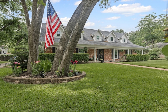 209 Shenandoah Dr, Euless, TX 76039 - cape cod home featuring a front lawn, brick siding, and a shingled roof