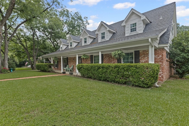 209 Shenandoah Dr, Euless, TX 76039 - cape cod-style house with brick siding, a front lawn, a shingled roof, and covered porch