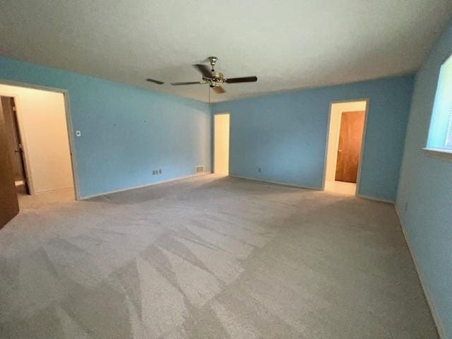 2621 Picadilly Ln, Denton, TX 76209 - carpeted spare room featuring a ceiling fan and baseboards