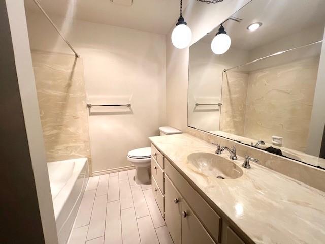 2621 Picadilly Ln, Denton, TX 76209 - full bathroom featuring vanity, toilet, and shower / bath combo