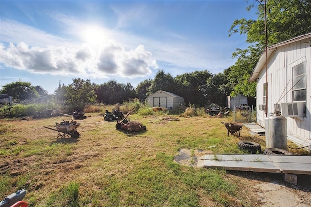 17128 County Road 3322, Frost, TX 76641 - view of grassy yard with cooling unit and an outdoor fire pit