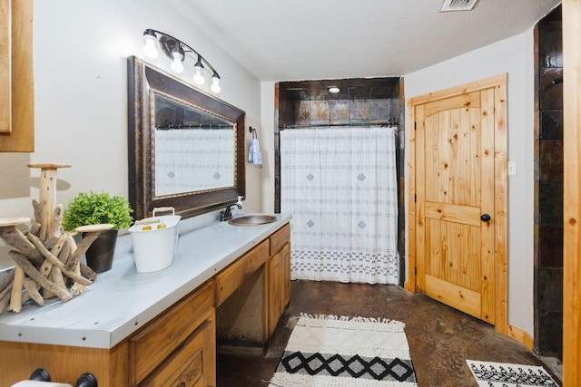 520 County Road 1743, Chico, TX 76431 - full bathroom with double vanity, finished concrete floors, and curtained shower