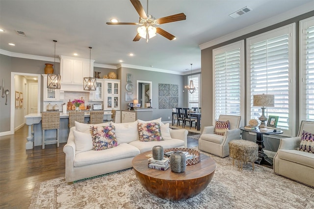 6309 Willow Ridge Trl, Flower Mound, TX 76226 - living room with a chandelier, wood finished floors, ornamental molding, recessed lighting, and a ceiling fan