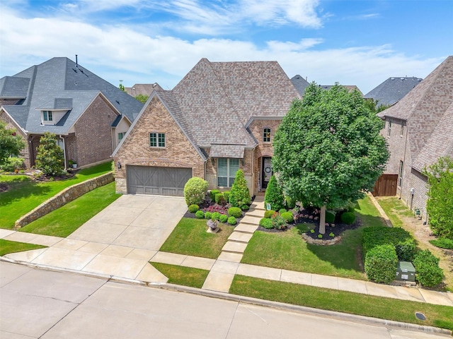 6309 Willow Ridge Trl, Flower Mound, TX 76226 - view of front of property with brick siding, concrete driveway, and a garage
