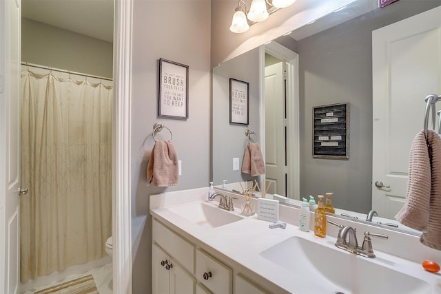 6309 Willow Ridge Trl, Flower Mound, TX 76226 - bathroom with toilet, double vanity, and a shower with shower curtain