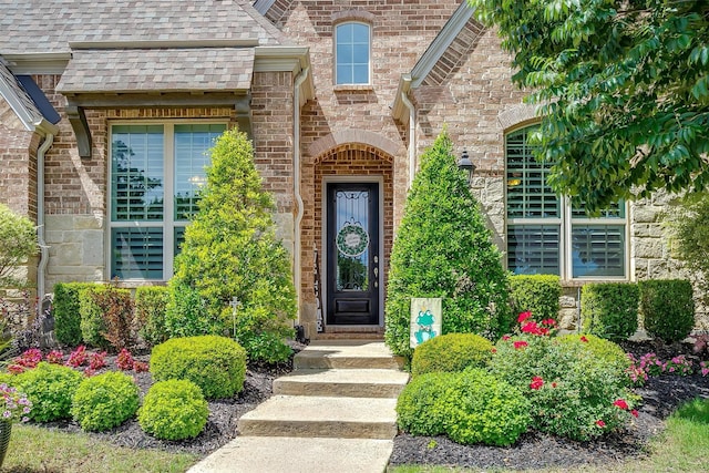 6309 Willow Ridge Trl, Flower Mound, TX 76226 - property entrance featuring roof with shingles and brick siding