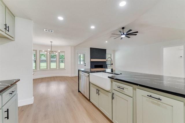 800 Shady Ln N, Keller, TX 76248 - kitchen with stainless steel dishwasher, a sink, dark countertops, open floor plan, and ceiling fan