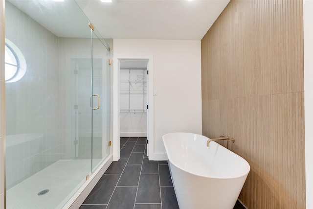 800 Shady Ln N, Keller, TX 76248 - full bath featuring a stall shower, tile patterned floors, a freestanding tub, and a spacious closet