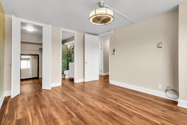 3883 Turtle Creek Blvd Unit 204, Dallas, TX 75219 - unfurnished dining area with wood finished floors and baseboards