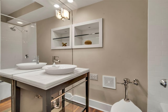 3883 Turtle Creek Blvd Unit 204, Dallas, TX 75219 - full bathroom with vanity, wood finished floors, tub / shower combination, and toilet