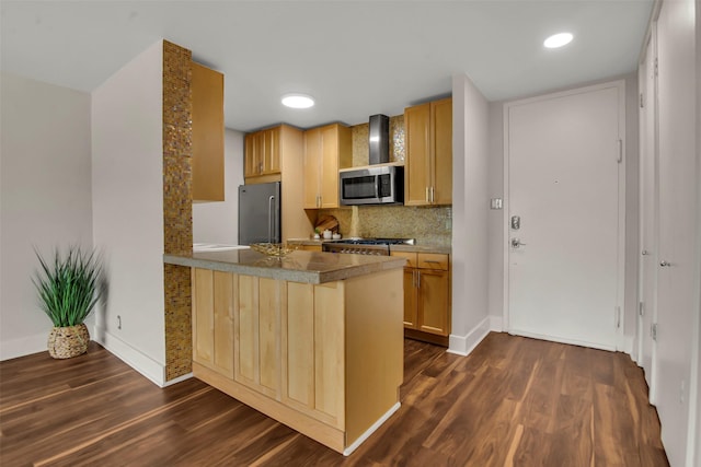 3883 Turtle Creek Blvd Unit 204, Dallas, TX 75219 - kitchen with stainless steel appliances, a peninsula, dark wood-style floors, tasteful backsplash, and baseboards