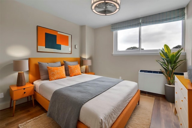 3883 Turtle Creek Blvd Unit 204, Dallas, TX 75219 - bedroom featuring wood finished floors and baseboards