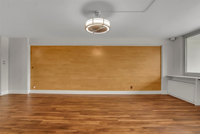 3883 Turtle Creek Blvd Unit 204, Dallas, TX 75219 - unfurnished dining area featuring wood finished floors and baseboards